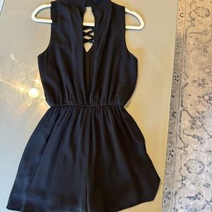 She + sky black romper. Around the neck , open back